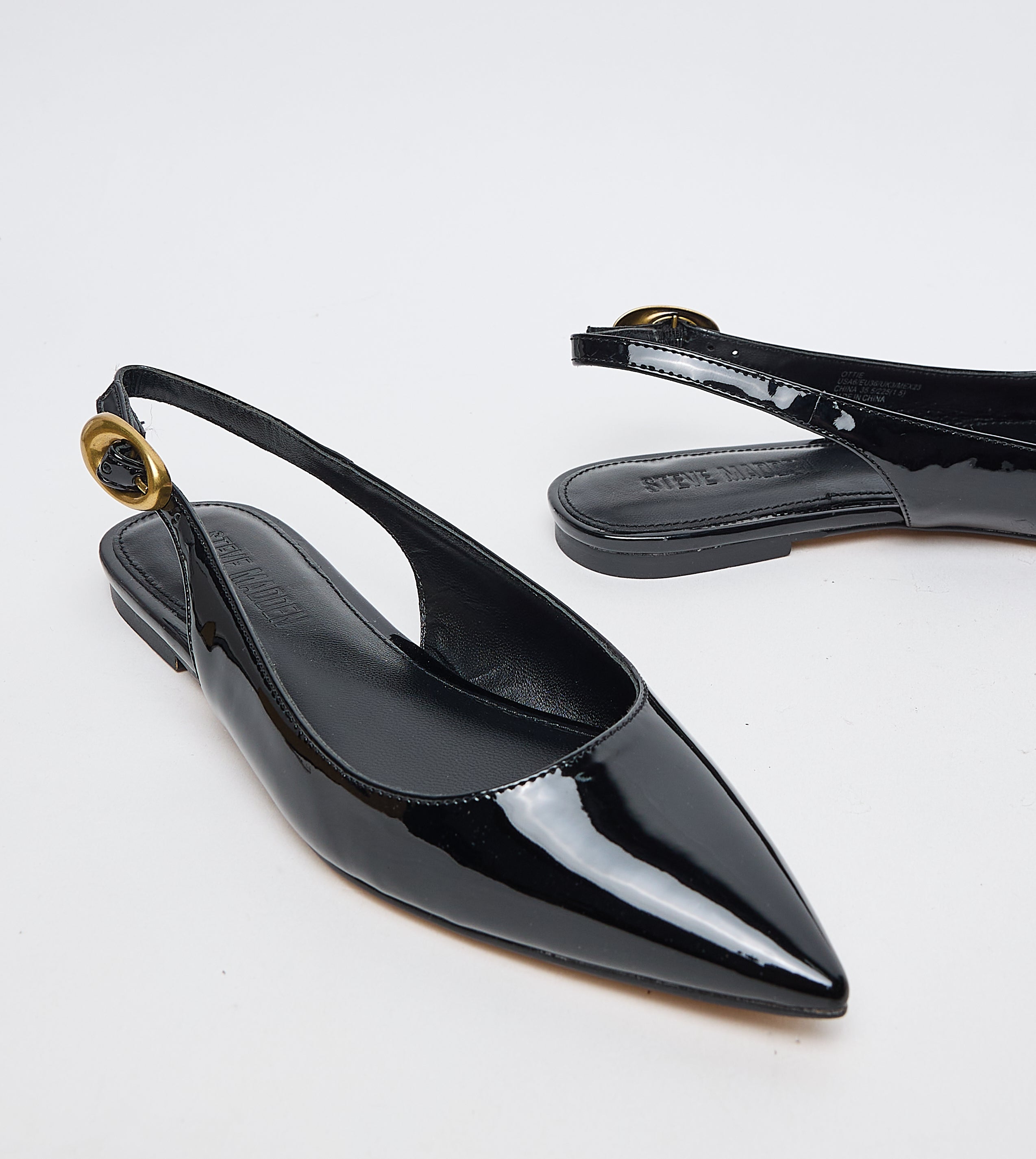 Steve Madden Ottie black patent flat sandals, sole view